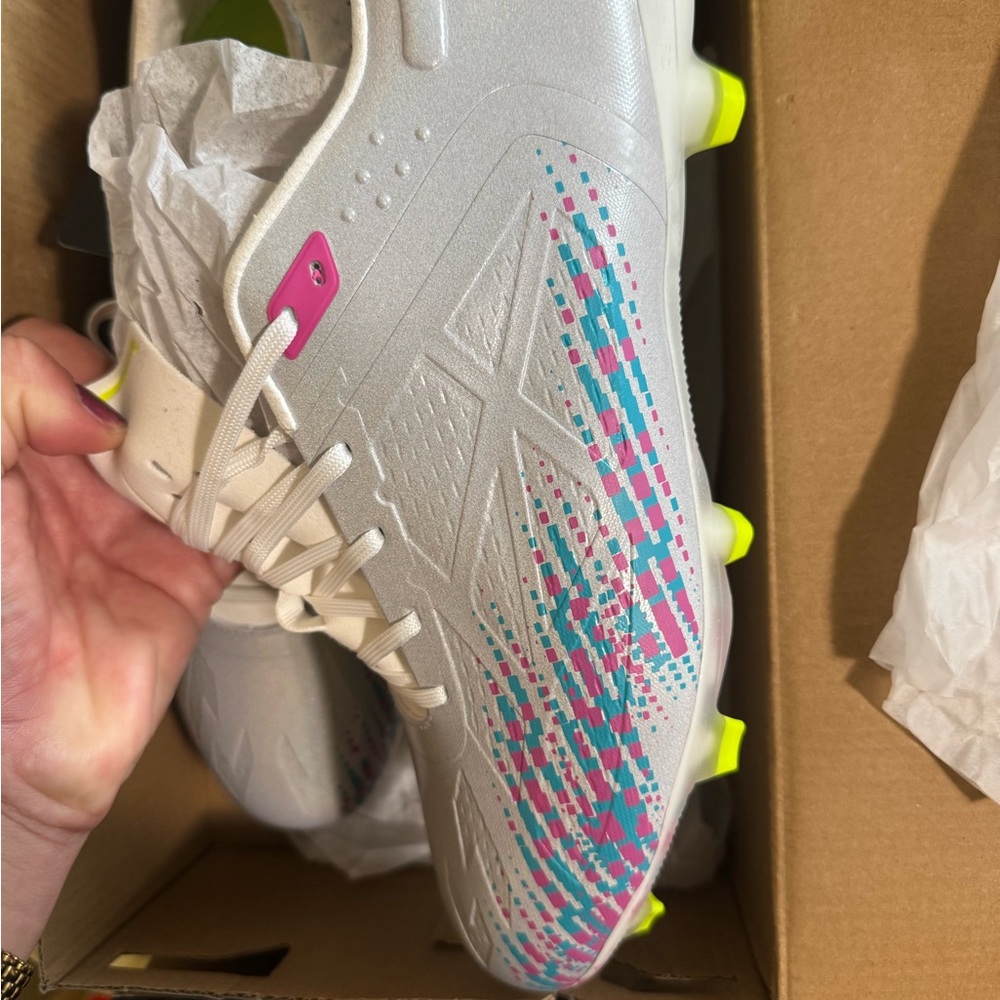 White Soccer Cleats with Pink and Blue Accents